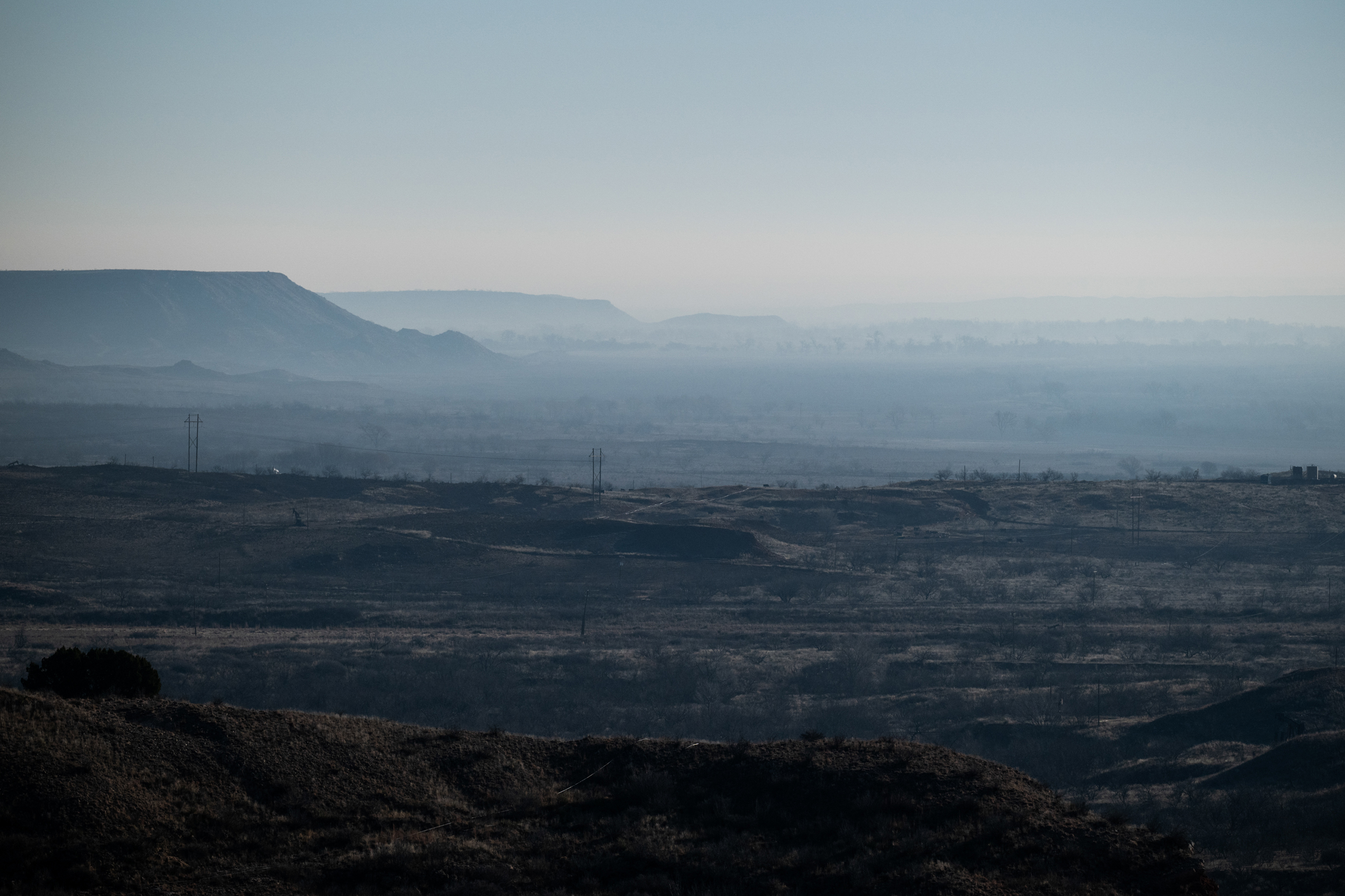 Smoke hangs in the Canadian River Valley south of Stinnett, Texas after multiple days of wild fires on March 1. Credit: Justin Rex/The Texas Tribune