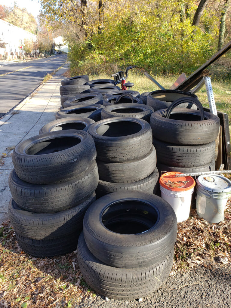 The 70 tires dumped in Eric Hayes’ neighborhood, which he collected and stacked. Credit: Courtesy photo