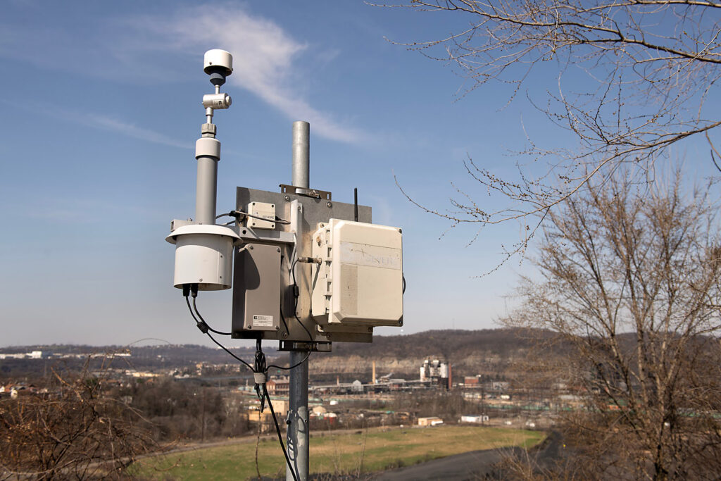 An air quality monitor sits on top of a hill overlooking Clairton Coke Works. Credit: Scott Goldsmith/Inside Climate News