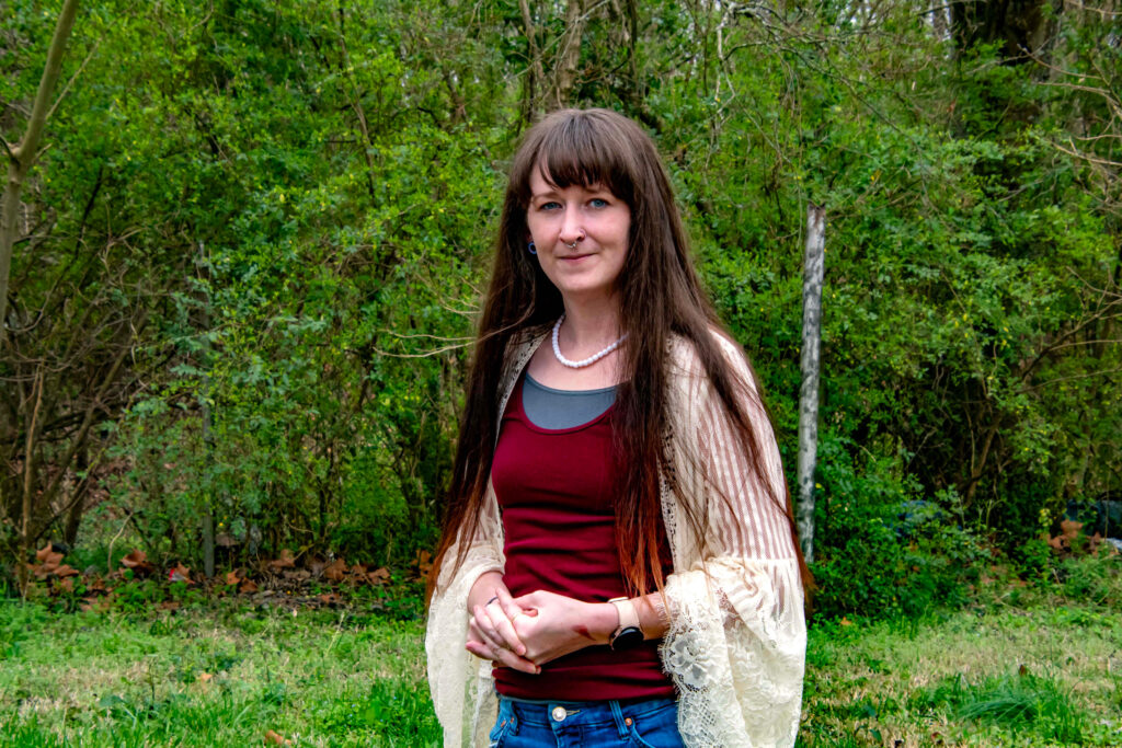 Kacey Brantley said she's suffered from headaches following her exposure to the fuel-contaminated waters of Village Creek, which runs along her backyard. Credit: Lee Hedgepeth/Inside Climate News