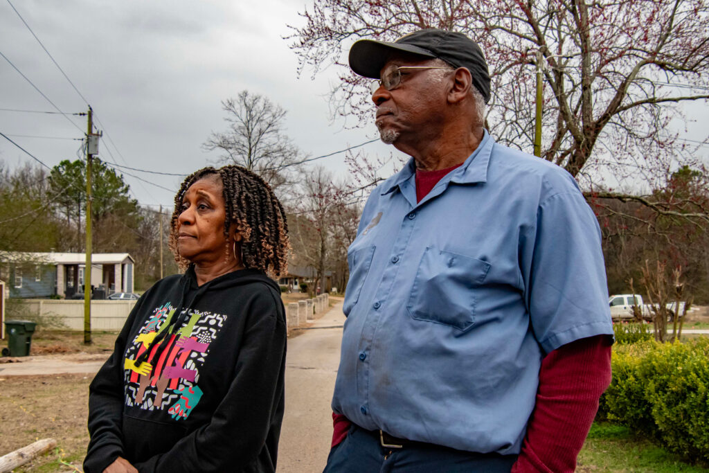 Pastor James Jamar of Athens and Diane Steele of the Limestone County NAACP answer questions about the issues in the Strain Road community. Photo credit: Lee Hedgepeth/Inside Climate News