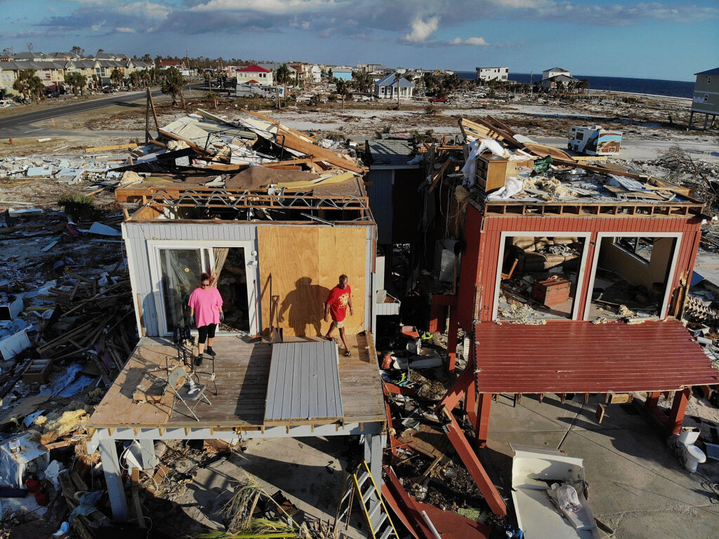 A couple begins the process of cleaning up their home after after it was heavily damaged by Hurricane Michael on Oct. 17, 2018 in Mexico Beach, Fla. Credit: Joe Raedle/Getty Images