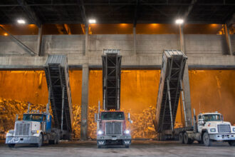 Trucks equipped with special containers that can hold up to 25 tons of garbage dump into the tipping hall of the Covanta Energy Montgomery County incinerator in Dickerson, Md. Credit: Robb Hill/The Washington Post via Getty Images