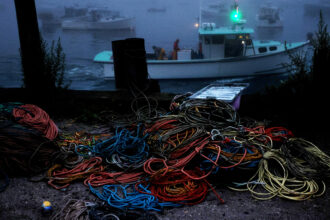 Coils of rope are seen in the parking lot as lobstermen head out to sea in Vinalhaven, Maine. Credit: Jessica Rinaldi/The Boston Globe via Getty Images