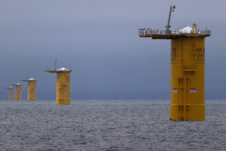 A row of mono piles that will be the base for offshore wind turbines near New Bedford, Mass. Credit: David L Ryan/The Boston Globe via Getty Images