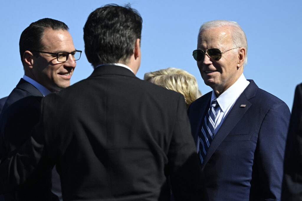 President Joe Biden is greeted by Pennsylvania Governor Josh Shapiro (left) upon arrival at the Philadelphia International Airport on Oct. 13, 2023. Credit: Andrew Caballero-Reynolds/AFP via Getty Images