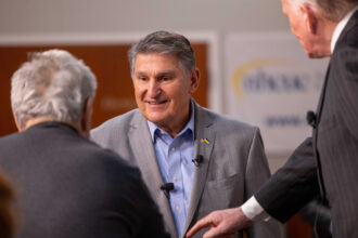 Sen. Joe Manchin arrives for a “Politics & Eggs” event at St. Anselm College's New Hampshire Institute of Politics on Jan. 12 in Manchester, N.H. Credit: Scott Eisen/Getty Images