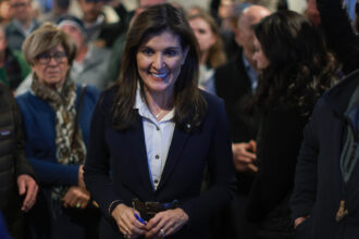 Republican presidential candidate, former U.N. Ambassador Nikki Haley, interacts with people during a campaign event on Jan. 19 in Milford, New Hampshire. Credit: Joe Raedle/Getty Images