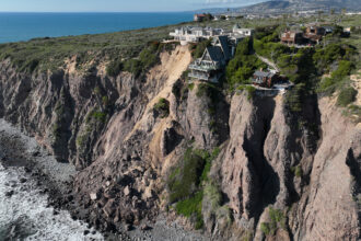 Landslides following a series of atmospheric river storms this month left three homes on-the-edge of a cliff in Dana Point, Calif. Credit: Allen J. Schaben/Los Angeles Times via Getty Images