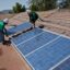 Two solar workers install solar panels on home in Oak View, Southern California. Credit: Joe Sohm/Visions of America/Universal Images Group via Getty Images
