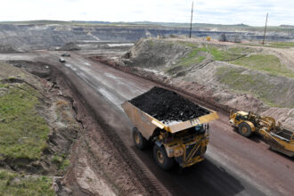 A truck loaded with coal drives away from the Eagle Butte Coal Mine in Gillette, Wyo. Credit: Matt McClain/The Washington Post via Getty Images
