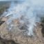 This December 2022 photo shows smoke and open flames at the landfill site near Moody, Alabama. In the time since, the fire has continued to burn underground. Credit: Courtesy of Moody Fire Department