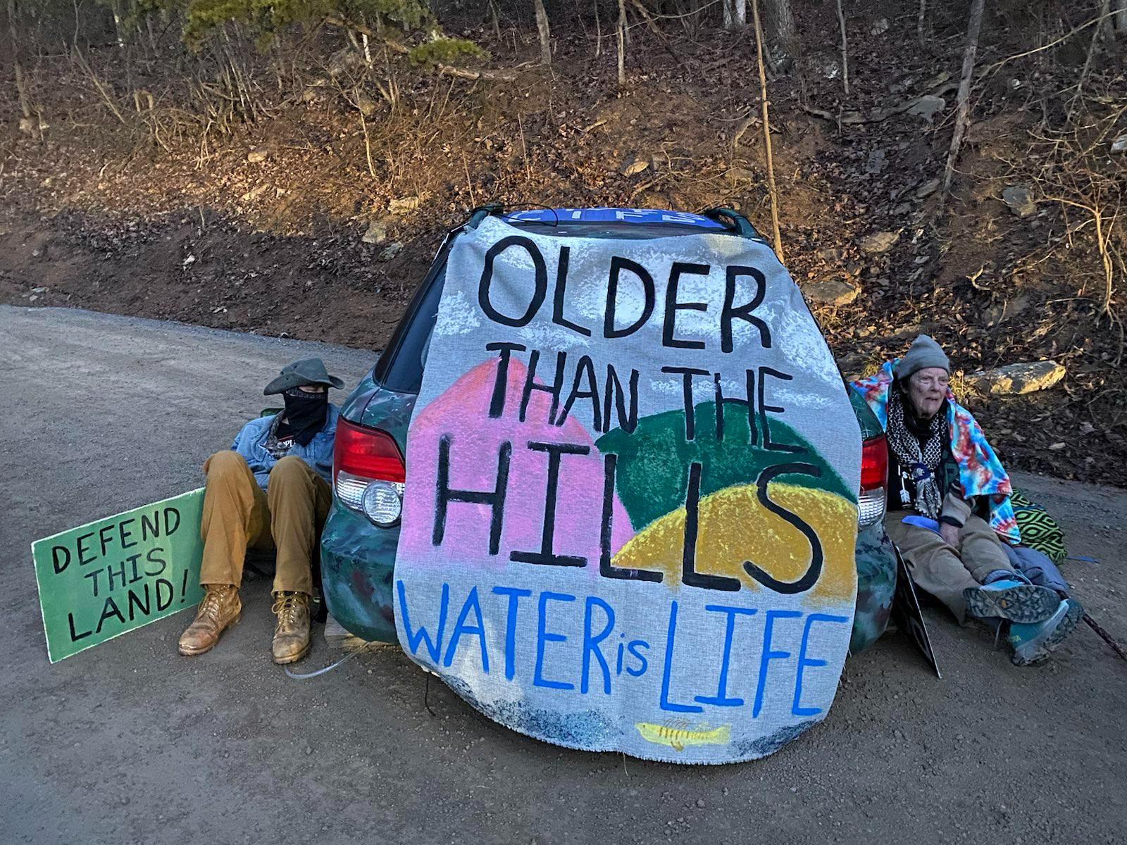 Pipeline opponents Andrew Hinz and Karen Bixler locked themselves to a broken-down car, blocking workers from accessing a construction site for the pipeline. Credit: Appalachians Against Pipelines